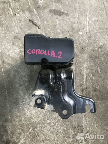 Блок ABS (насос) (Toyota Corolla) Блок ABS (насос) (Toyota Corolla)