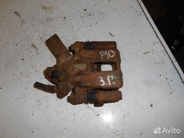 Суппорт задний правый Nissan Primera P10