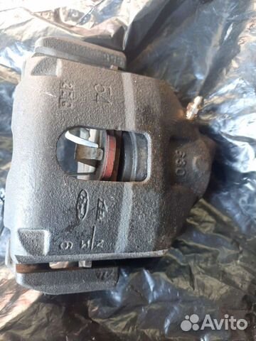 Суппорт mazda demio правый